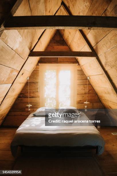 bedroom of a wooden cabin - idyllic cottage stock pictures, royalty-free photos & images