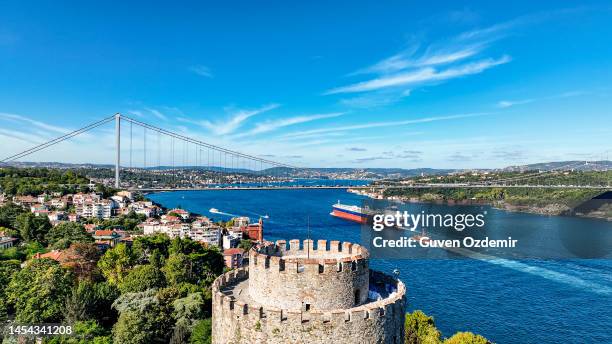 aerial view of rumeli fortress and istanbul bosphorus, rumeli fortress castle, historical istanbul castle, aerial view of istanbul, istanbul rumeli fortress area, bosphorus bridge view, colorful istanbul landscape, haunted mansion istanbul - bosphorus stockfoto's en -beelden