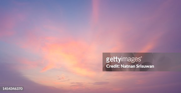 fluffy orange clouds at sunset