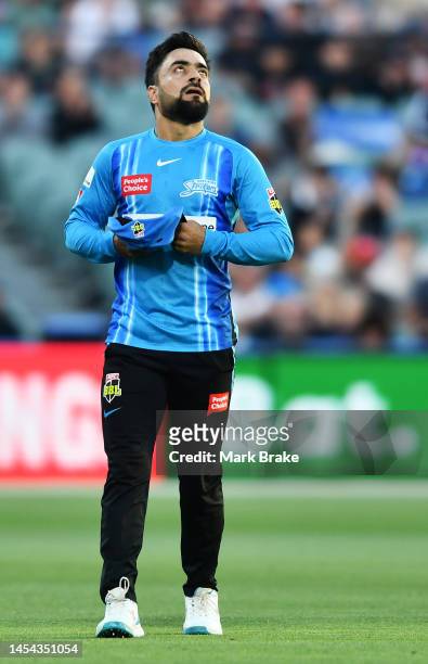 Rashid Khan of the Strikers after bowling his last ball during the Men's Big Bash League match between the Adelaide Strikers and the Hobart...