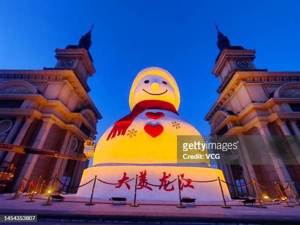 An 18-meter-tall snowman is illuminated at Harbin Music Park ahead of Chinese New Year, the Year of the Rabbit, on January 5, 2023 in Harbin,...