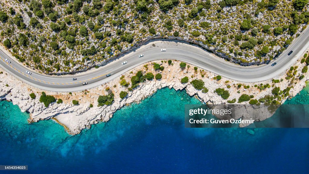 Aerial view of beach side road, aerial view of cliff side road, Aerial view of sloping and curvy road, background for vacation travel, most beautiful roads, beautiful road with scenery, finike,demre