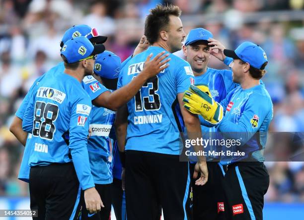 Harry Conway of the Strikers celebrates the wicket of Matthew Wade of the Hurricanes during the Men's Big Bash League match between the Adelaide...