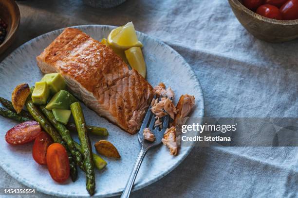 healthy gourmet food. salmon fillet and vegetables. ketogenic diet - low carb diet stock pictures, royalty-free photos & images