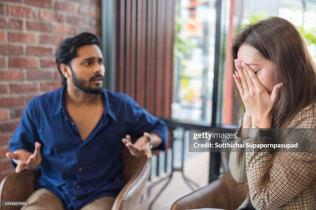 Young couple arguing while having problems in their relationship.
