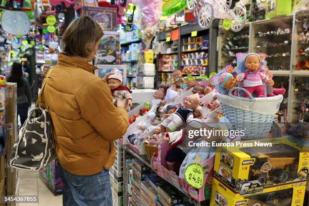 Woman holds a toy at the Sarasus toy store on January 5 in Madrid, Spain. The days leading up to Three Kings Day are one of the most important weeks...