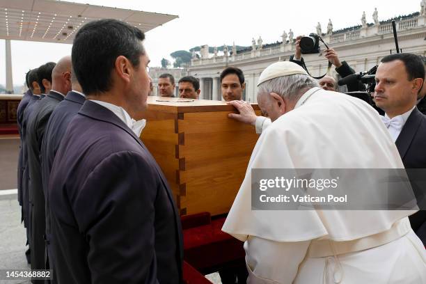 Pope Francis pays his respect to the coffin of Pope Emeritus Benedict XVI during his funeral mass at St Peter's Square on January 05, 2023 in Vatican...