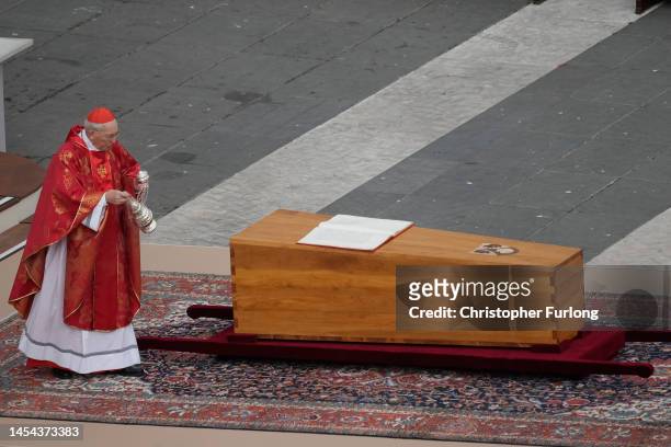 Cardinal Giovanni Battista Re blesses the coffin of Pope Emeritus Benedict XVI during the funeral mass at St. Peter's square on January 5, 2023 in...