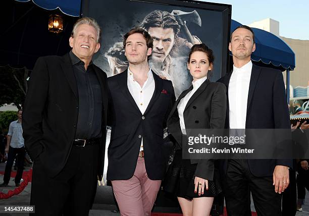 Producer Joe Roth, actors Sam Claflin, Kristen Stewart and director Rupert Sanders arrive at a screening of Universal Pictures' "Snow White and The...