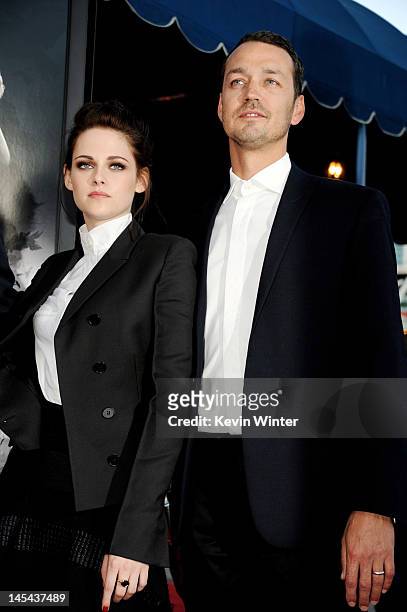 Actress Kristen Stewart and director Rupert Sanders arrive at a screening of Universal Pictures' "Snow White and The Huntsman" at the Village Theatre...