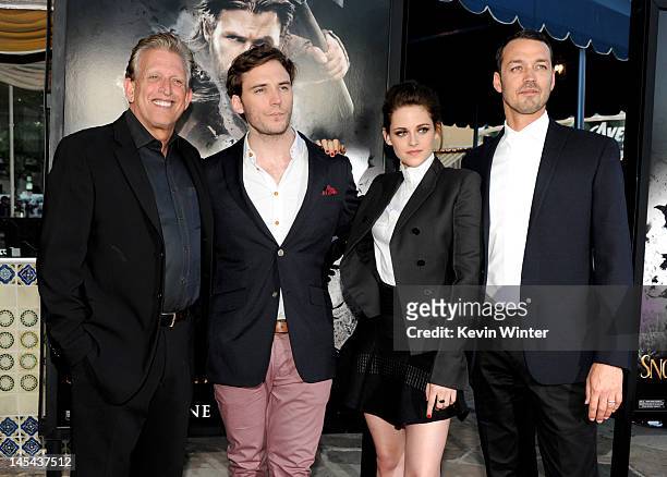 Producer Joe Roth, actors Sam Claflin, Kristen Stewart and director Rupert Sanders arrive at a screening of Universal Pictures' "Snow White and The...