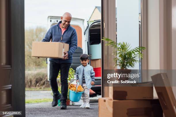 helping grandfather move in - removal van stock pictures, royalty-free photos & images