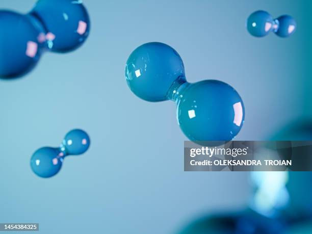 hydrogen molecule on blue background. 3d render of green fuel - átomo imagens e fotografias de stock