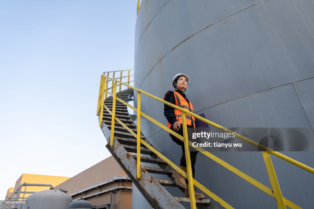 A female engineer works in a chemical plant