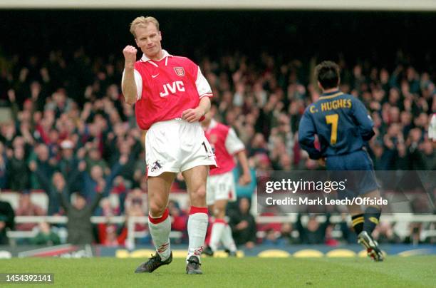 April 1998, London - FA Carling Premiership - Arsenal v Wimbledon - Dennis Bergkamp celebrates after scoring the third goal for Arsenal at Highbury.