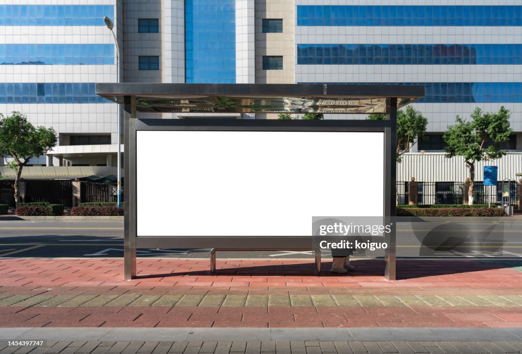 Blank billboard at city bus stop