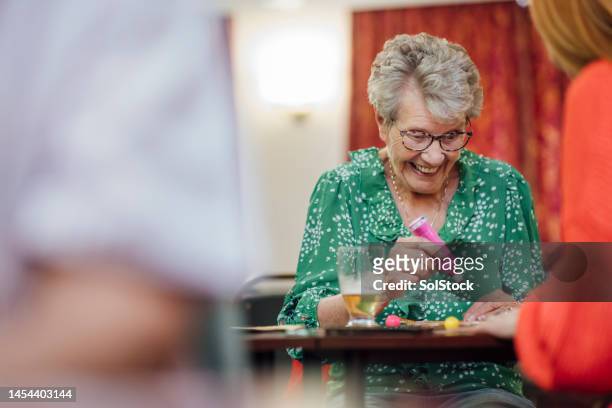 i got another number! - elderly people stock pictures, royalty-free photos & images