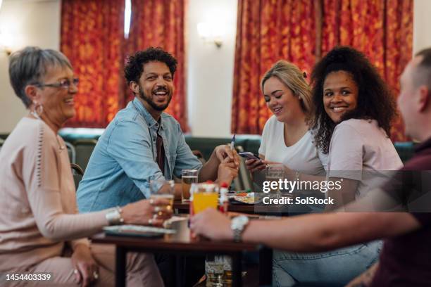 a good group of friends - cosy pub stock pictures, royalty-free photos & images