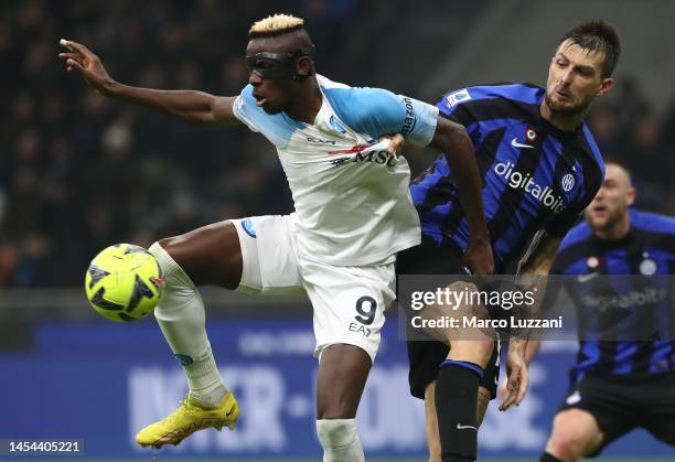 Francesco Acerbi of FC Internazionale competes with Victor Osimhen of SSC Napoli during the Serie A match between FC Internazionale and SSC Napoli at...