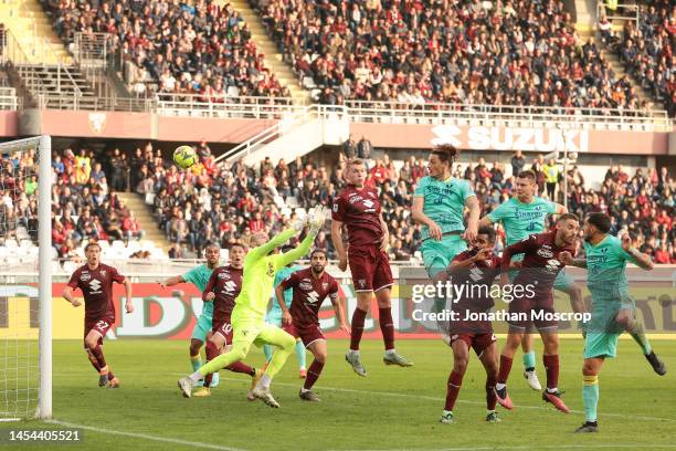 Milan Djuric of Hellas Verona anticpates Perr Schuurs of Torino FC to head the ball past Vanja Milinkovic-Savic in the Torino goal and give the side...