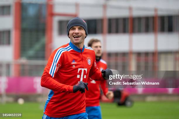 Thomas Müller of FC Bayern München smiles during a training session at Saebener Strasse training ground on January 05, 2023 in Munich, Germany.