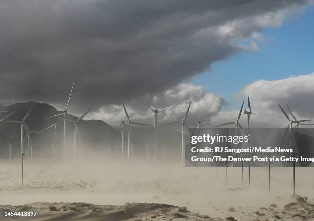 Dust storm moves across a wind farm on December 30, 2022 north of Palm Springs, California. Drought and climate change are adding stress in the...