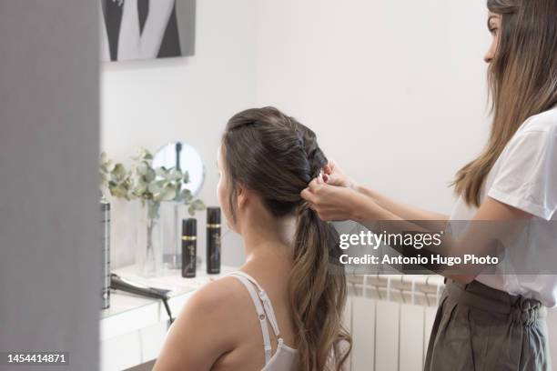 hairdresser doing a special hairstyle for the bride. hairdressing session. - quarantine wedding stock pictures, royalty-free photos & images