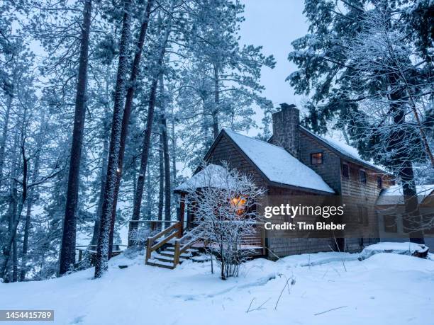 rustic cabin in winter snow/ - michigan winter stock pictures, royalty-free photos & images