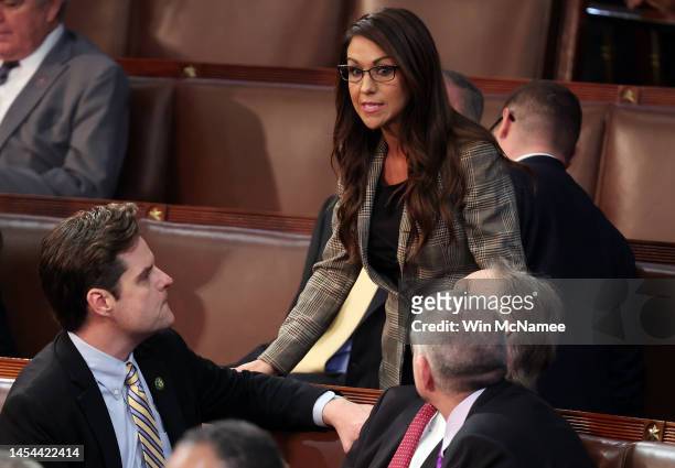 Rep.-elect Lauren Boebert talks to Rep.-elect Matt Gaetz in the House Chamber during the third day of elections for Speaker of the House at the U.S....