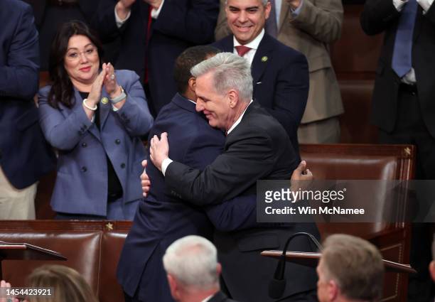 House Republican Leader Kevin McCarthy hugs Rep.-elect John James in the House Chamber during the third day of elections for Speaker of the House at...