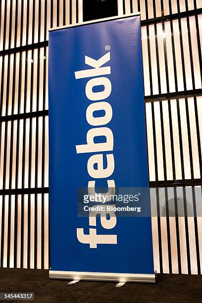 Facebook Inc. Logo stands on display during a news conference at the Armani Hotel to announce the opening of a Facebook office in Dubai, United Arab...