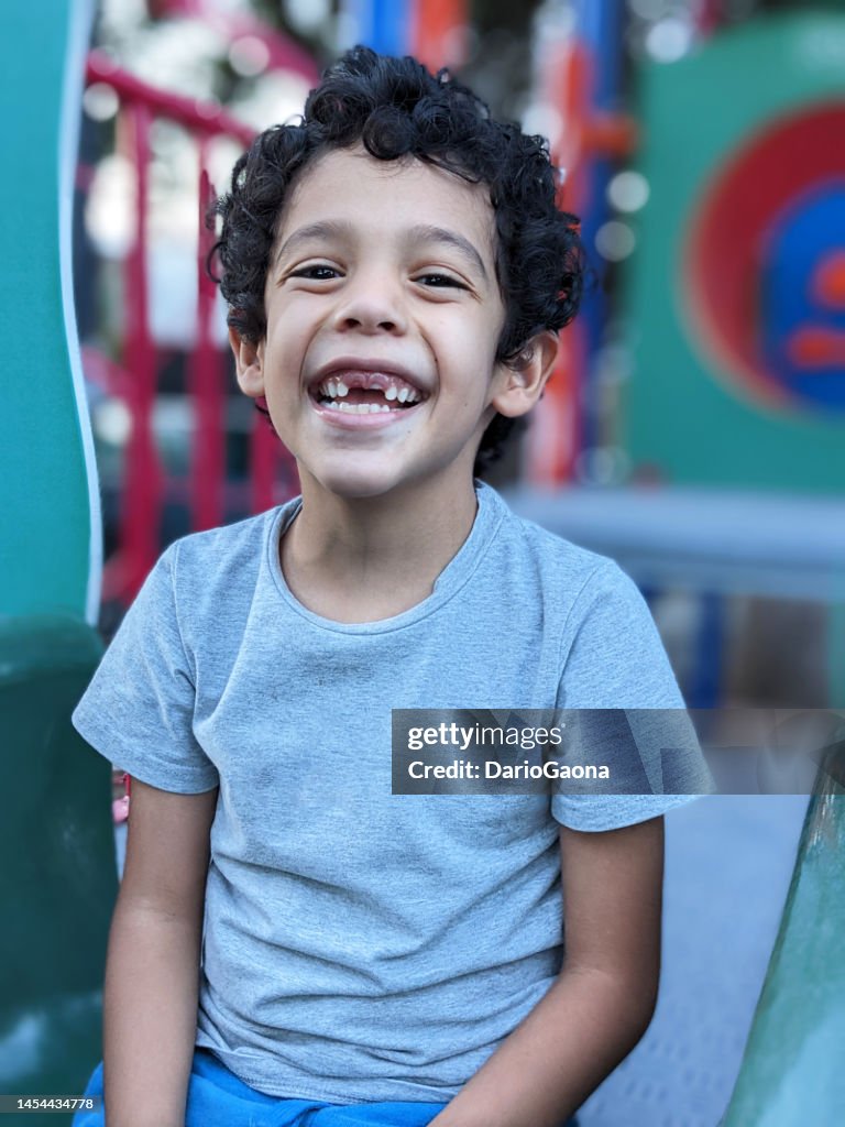 Toothless child in outdoor play