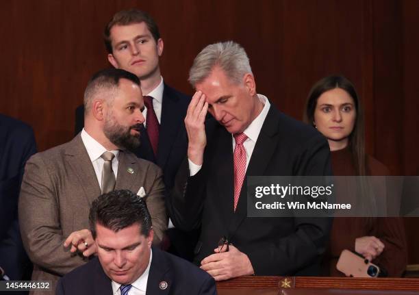 Rep.-elect Cory Mills talks to House Republican Leader Kevin McCarthy in the House Chamber during the third day of elections for Speaker of the House...