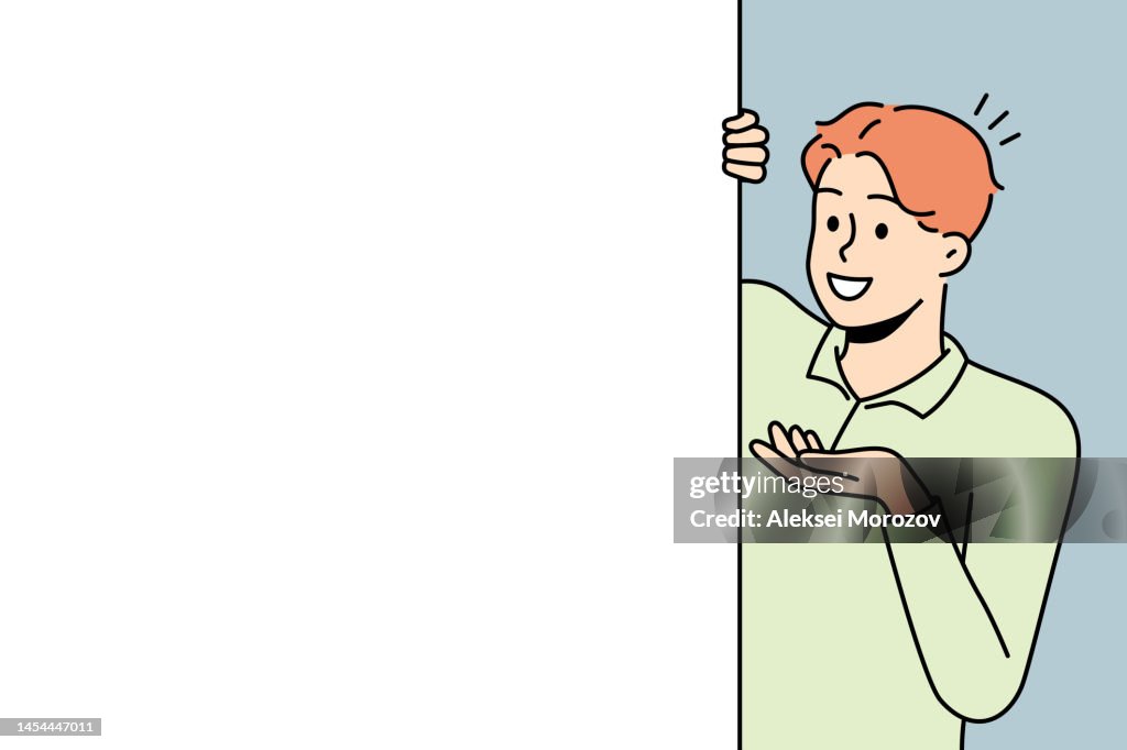 Smiling man look behind mockup poster