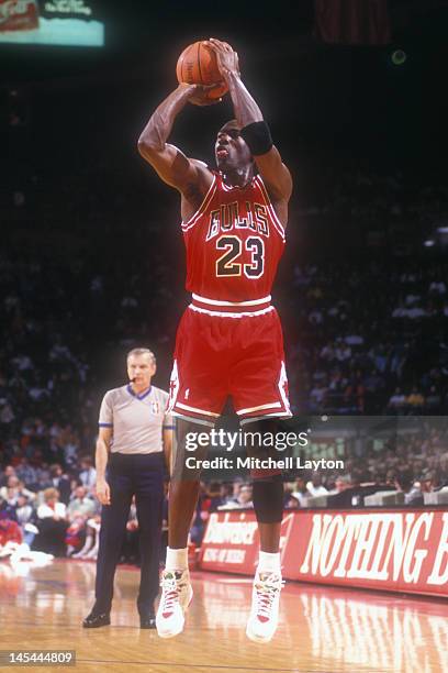 Michael Jordan of the Chicago Bulls takes a jump shot during a basketball game against the Washington Bullets at the Capitol Centre on December 14,...