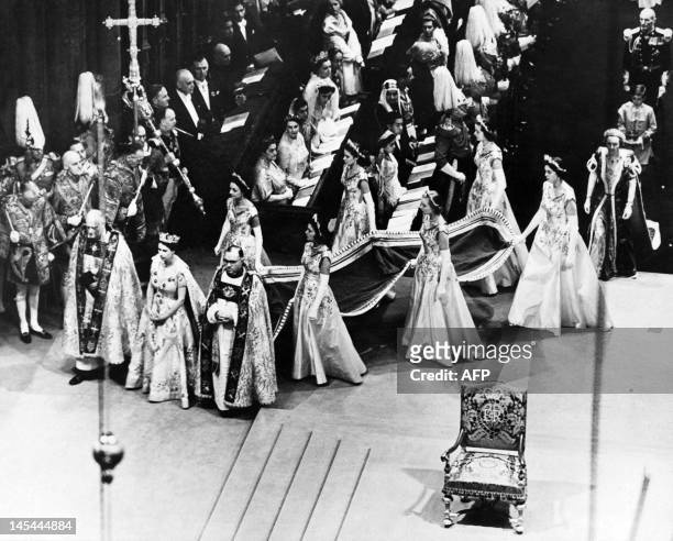 Queen Elizabeth II, surrounded by the bishop of Durham Lord Michael Ramsay and the bishop of Bath and Wells Lord Harold Bradfield, walks to the altar...