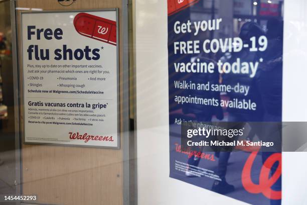 Flu and coronavirus vaccine signage is seen at a Duane Reade by on Broadway on January 05, 2023 in New York City. Walgreens Boots Alliance reported...