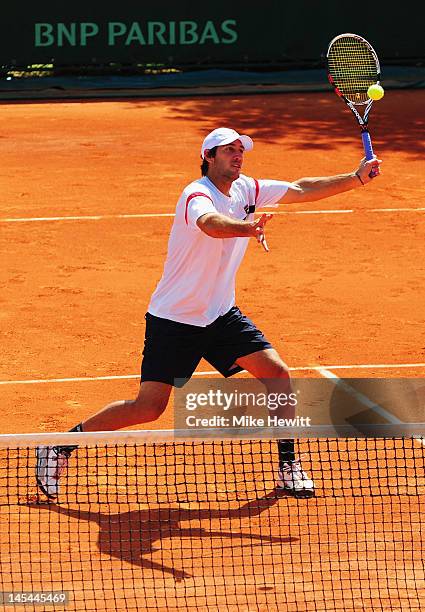 Carsten Ball of Australia plays a forehand during the men's doubles first round match between Carsten Ball of Australia and his team-mate Jamie...