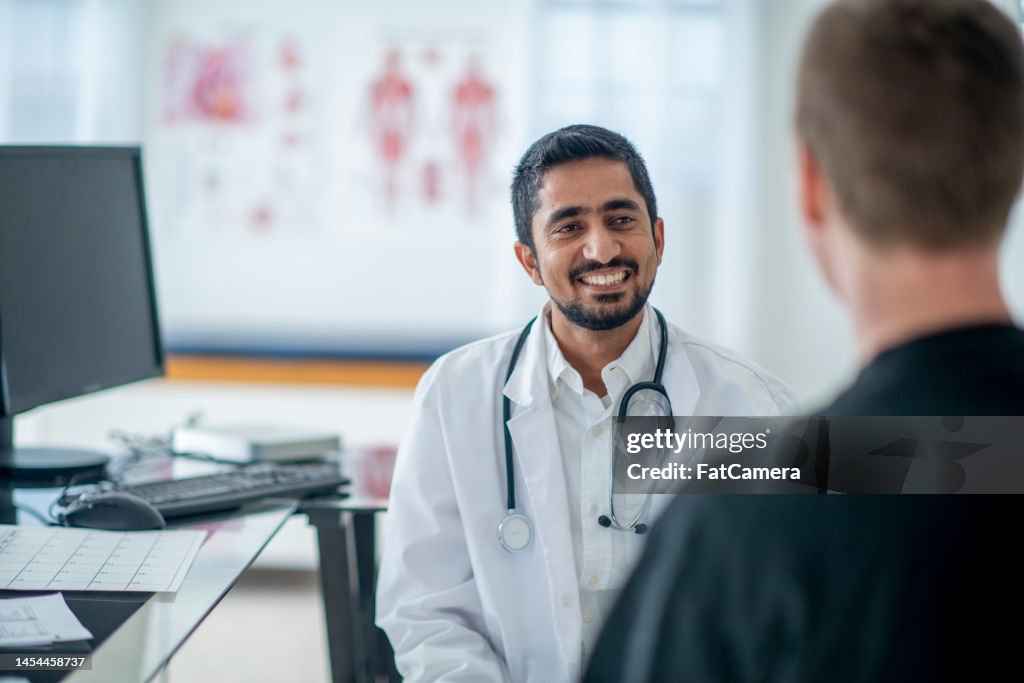 Male Doctor with a Patient