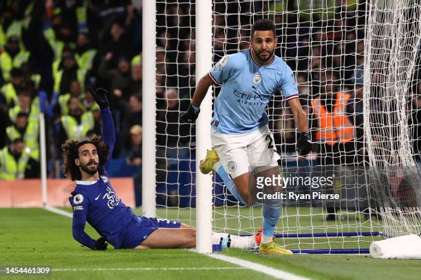 Riyad Mahrez of Manchester City celebrates after scoring the team's first goal as Marc Cucurella of Chelsea reacts during the Premier League match...