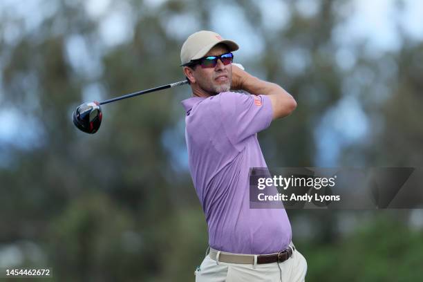 Adam Scott of Australia plays his shot from the fourth tee during the first round of the Sentry Tournament of Champions at Plantation Course at...