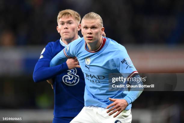 Erling Haaland of Manchester City looks on whilst under pressure from Lewis Hall of Chelsea during the Premier League match between Chelsea FC and...