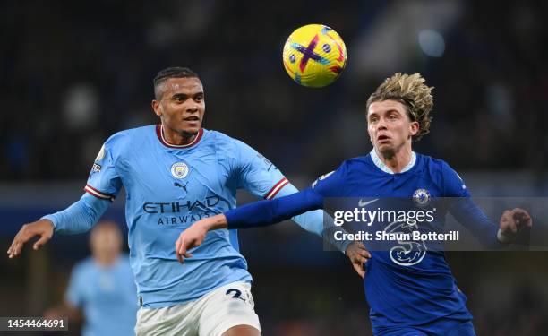 Manuel Akanji of Manchester City contends for the aerial ball with Conor Gallagher of Chelsea during the Premier League match between Chelsea FC and...