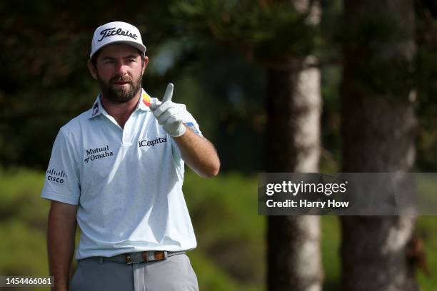 Cameron Young of the United States gestures before playing his shot from the second tee during the first round of the Sentry Tournament of Champions...