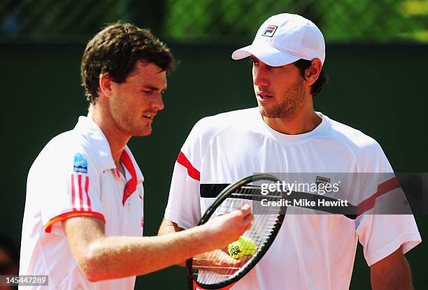 Carsten Ball of Australia talks to partner Jamie Murray of Great Britain during their men's doubles first round match against Yen-Hsun Lu of Taiwan...