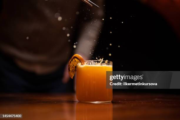 a glass of cocktail with splash - splashing cocktail stock pictures, royalty-free photos & images