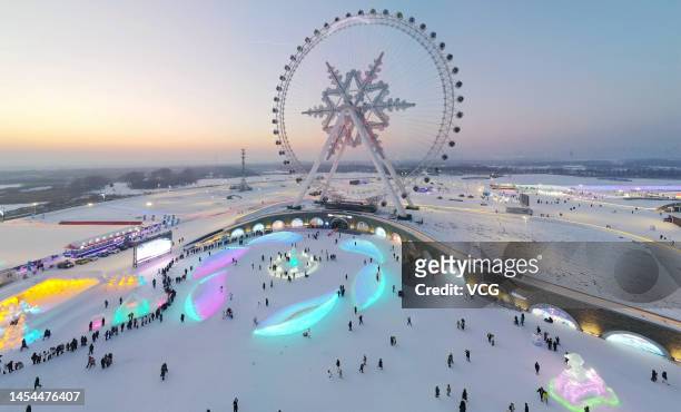 People visit Harbin Ice and Snow World during the opening ceremony of the 39th Harbin International Ice and Snow Festival on January 5, 2023 in...