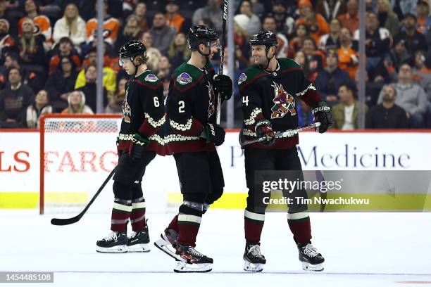 Patrik Nemeth and Zack Kassian of the Arizona Coyotes speak during the first period against the Philadelphia Flyers at Wells Fargo Center on January...