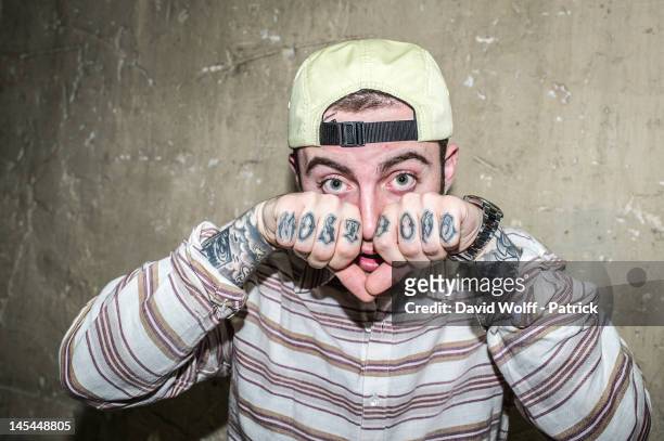 Mac Miller poses during photo session backstage at Casino de Paris on May 30, 2012 in Paris, France.