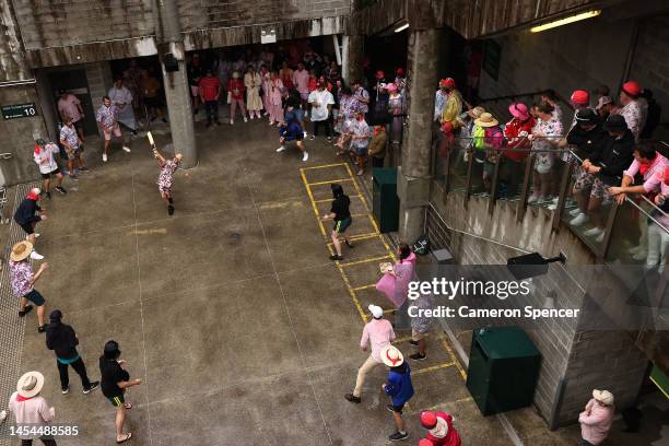 Spectators play an impromptu game of cricket behind the Victor Trumper Stand during a rain delay during day three of the Second Test match in the...